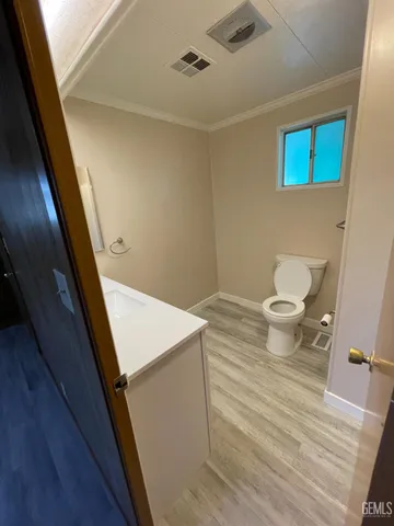 a bathroom with a sink a mirror and a vanity