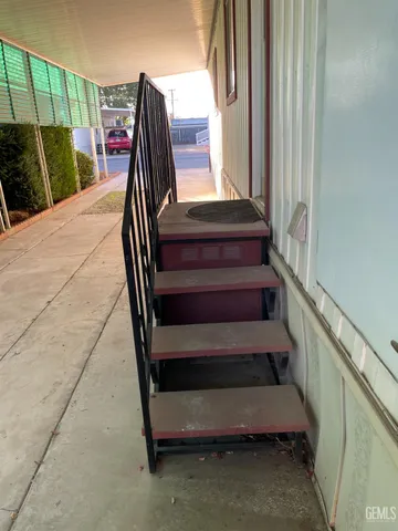 a view of a porch with wooden floor