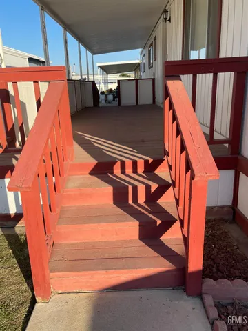 a view of a room with wooden floor and stairs