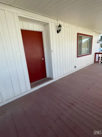 a view of staircase with white walls and railing