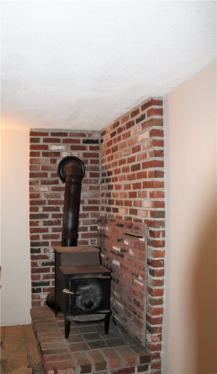 7 Isaac Fiske Road Coventry, RI 02827 - Photo 14 of 23 Wood Stove in basement