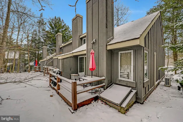 a kitchen with stainless steel appliances granite countertop a refrigerator sink and stove