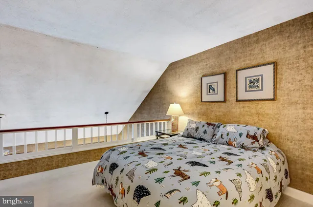 a en suite bathroom with a granite countertop sink and a mirror