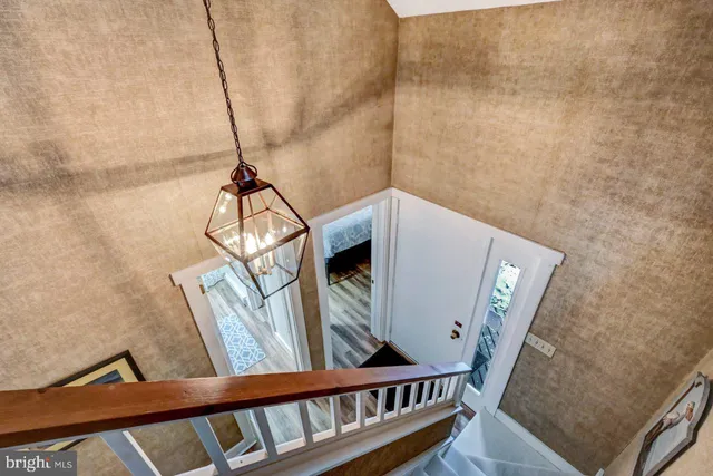 a balcony with furniture and wooden floor