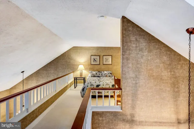 a view of an empty room and wooden floor