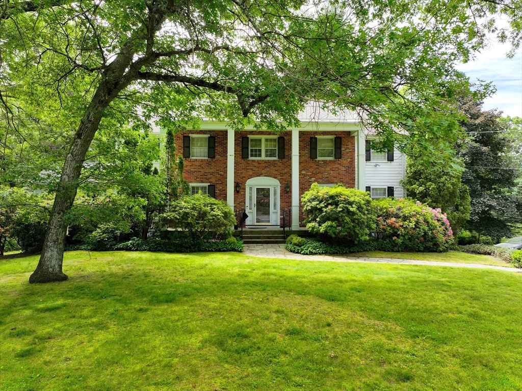 25 Rockport Road Weston, MA 02493 - Photo 1 of 13 a front view of a house with yard and green space