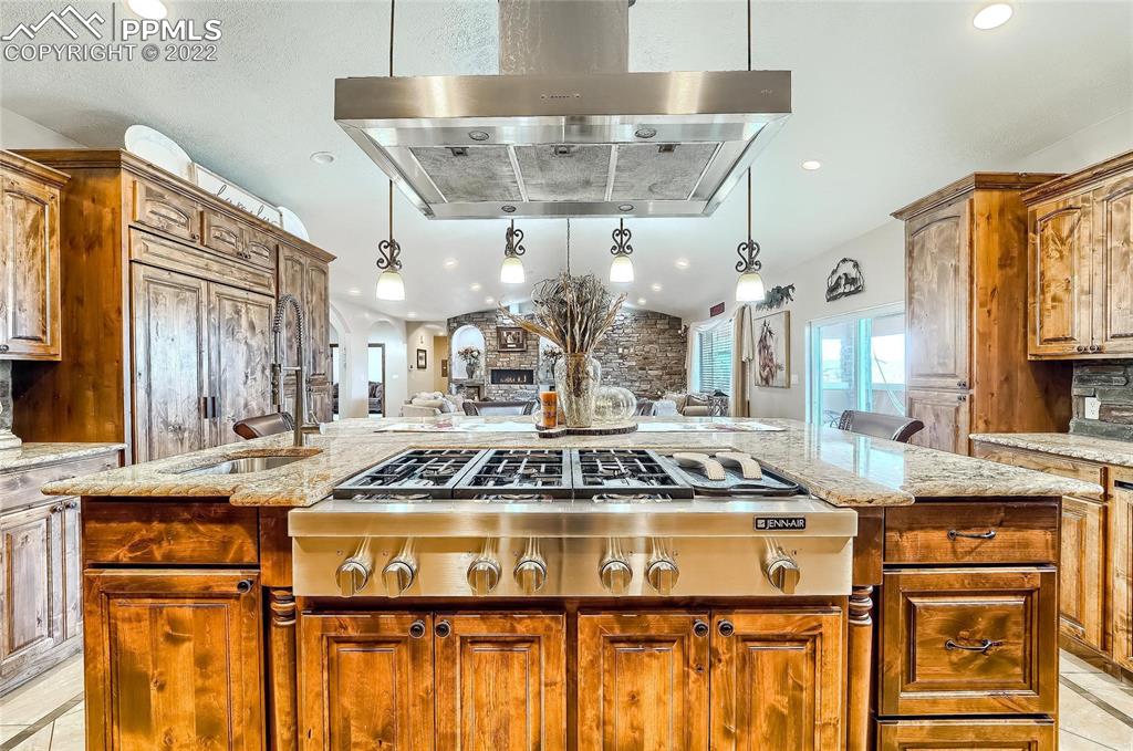 1777 16th Street Greeley, CO 80631 - Photo 11 of 42 a kitchen with a stove and a chandelier