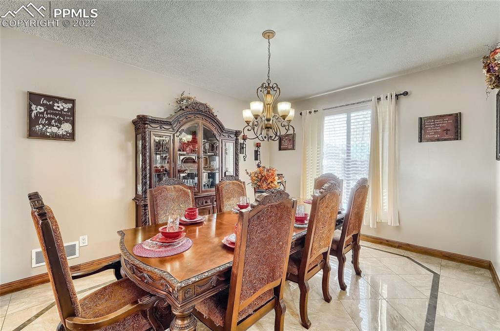1777 16th Street Greeley, CO 80631 - Photo 12 of 42 a view of a dining room with furniture and window