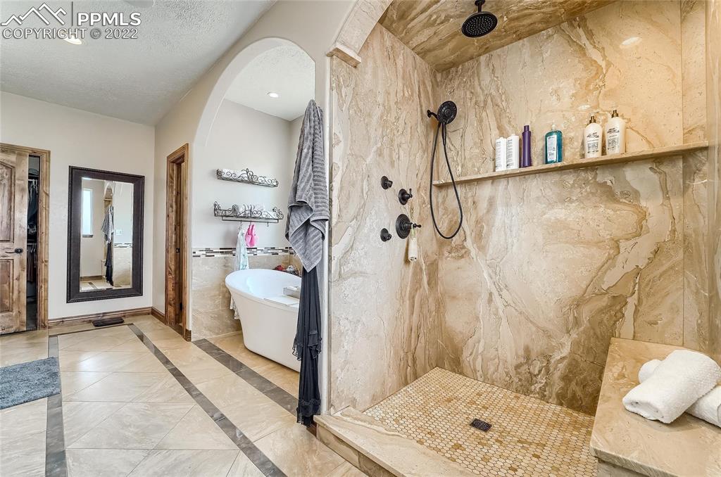 1777 16th Street Greeley, CO 80631 - Photo 17 of 42 a bathroom with a bathtub and a shower