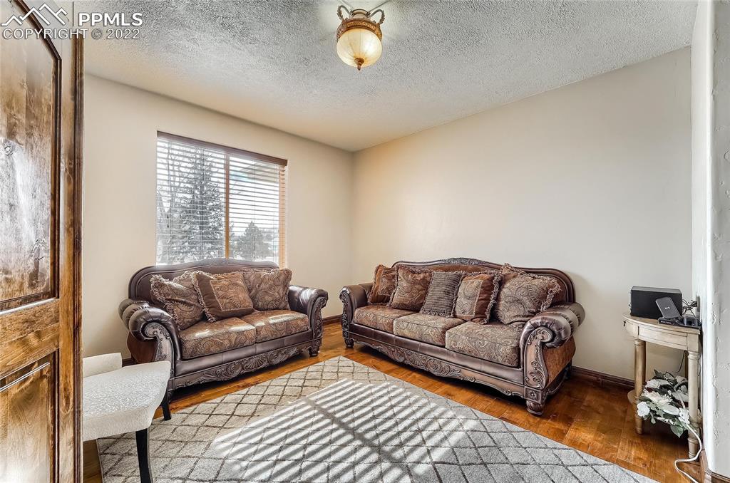 1777 16th Street Greeley, CO 80631 - Photo 18 of 42 a living room with furniture and a window