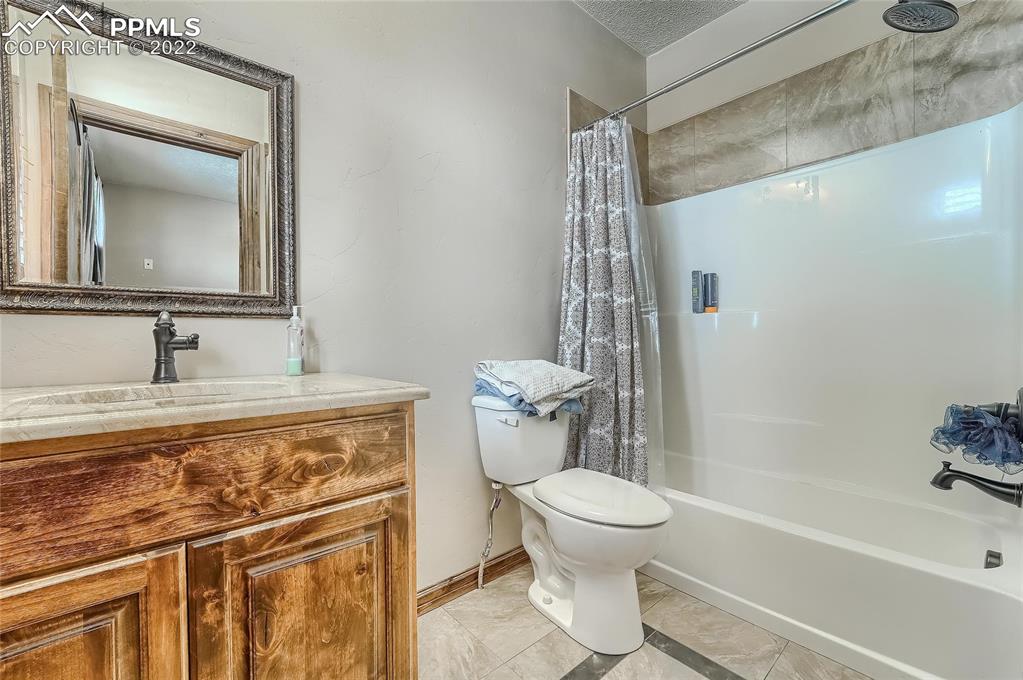 1777 16th Street Greeley, CO 80631 - Photo 25 of 42 a bathroom with a sink toilet and shower