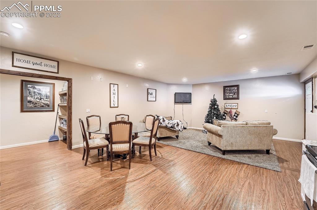 1777 16th Street Greeley, CO 80631 - Photo 29 of 42 a living room with furniture and wooden floor