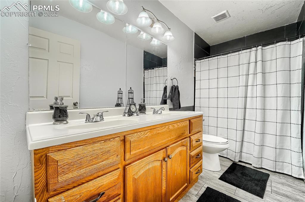 1777 16th Street Greeley, CO 80631 - Photo 35 of 42 a bathroom with a sink a toilet and shower