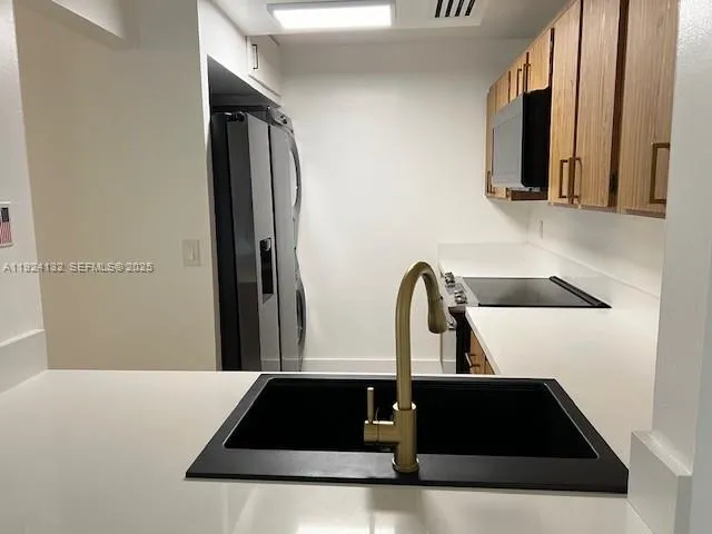 a close view of sink and mirror