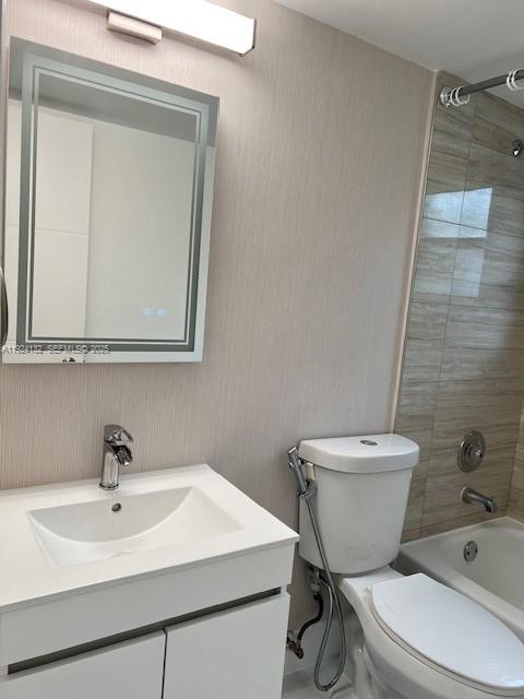 6735 West 26th Drive, Unit 125 Hialeah, FL 33016 - Photo 4 of 9 a white toilet sitting next to a bathroom sink
