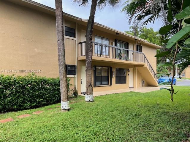 6735 West 26th Drive, Unit 125 Hialeah, FL 33016 - Photo 9 of 9 a view of house with a yard