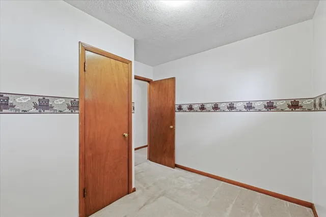 a view of a hallway with closet