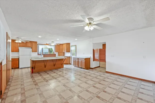a kitchen with stainless steel appliances a cabinet and a refrigerator