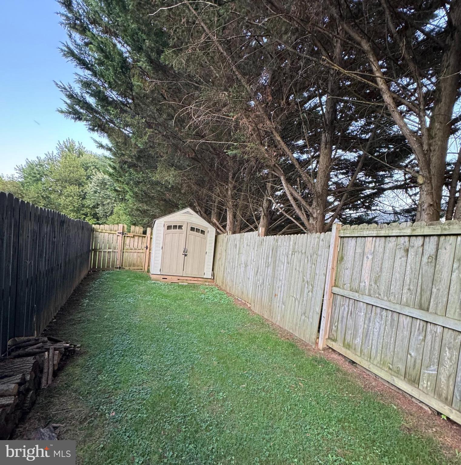 24 Keppels Mill Court Rising Sun, MD 21911 - Photo 13 of 19 a view of a backyard with wooden fence and a large tree