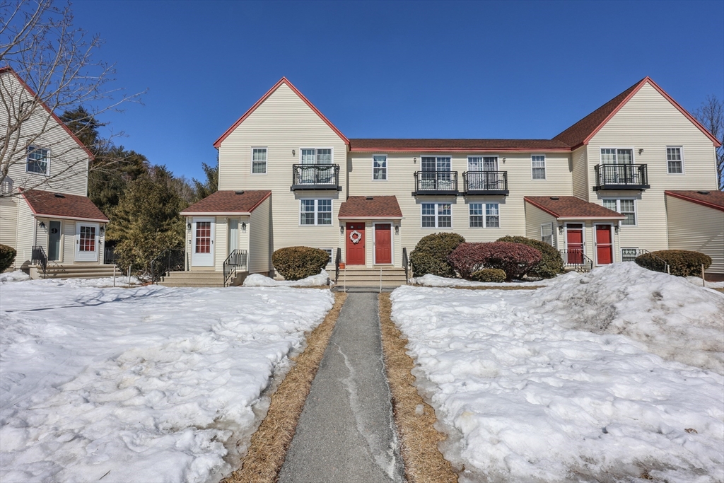 5 East Ridge Road, Unit A Merrimack, NH 03054 - Photo 1 of 19 a front view of a house with a yard