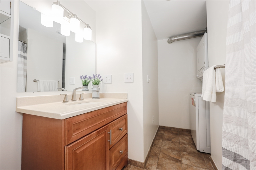 5 East Ridge Road, Unit A Merrimack, NH 03054 - Photo 16 of 19 a bathroom with a sink and a mirror