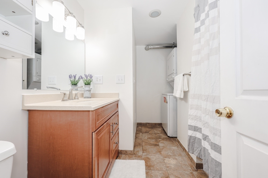 5 East Ridge Road, Unit A Merrimack, NH 03054 - Photo 17 of 19 a bathroom with a sink vanity and a mirror