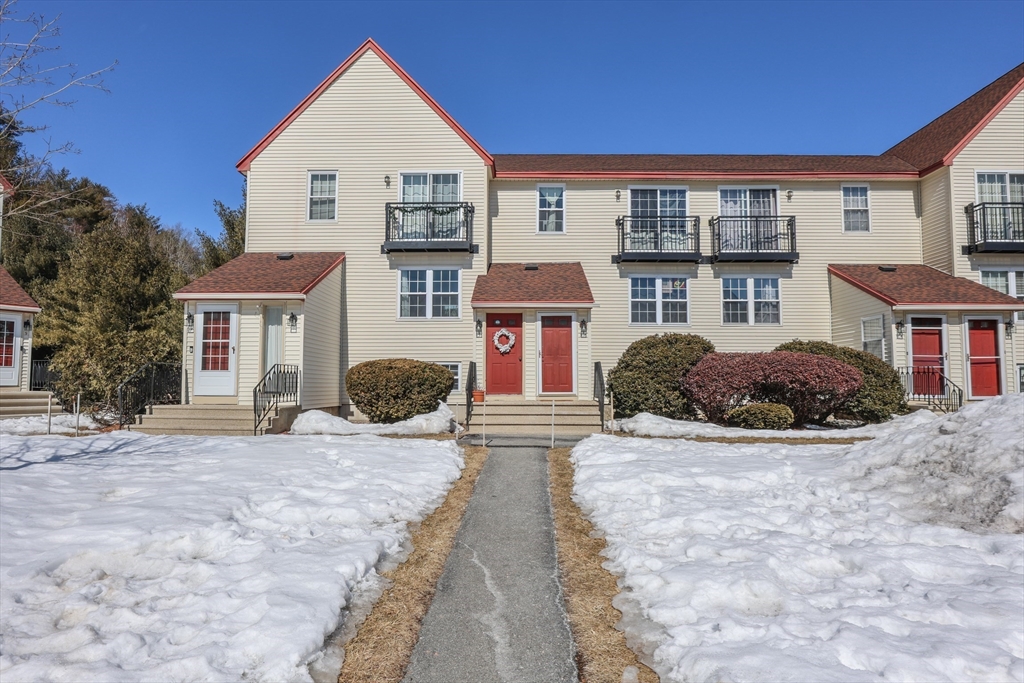 5 East Ridge Road, Unit A Merrimack, NH 03054 - Photo 2 of 19 a front view of a house with a yard