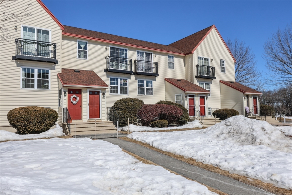 5 East Ridge Road, Unit A Merrimack, NH 03054 - Photo 3 of 19 a front view of a house with a yard