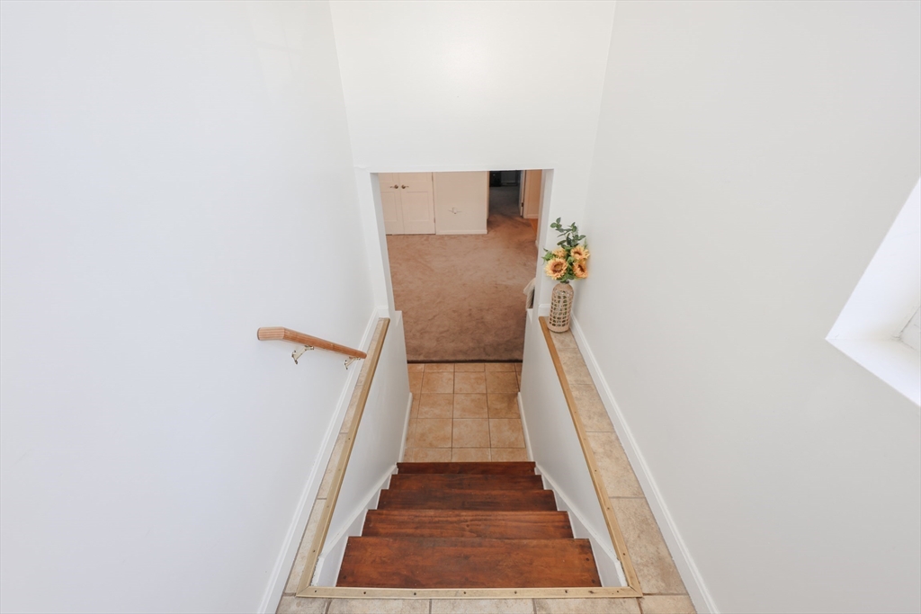 5 East Ridge Road, Unit A Merrimack, NH 03054 - Photo 5 of 19 a view of a hallway with wooden floor