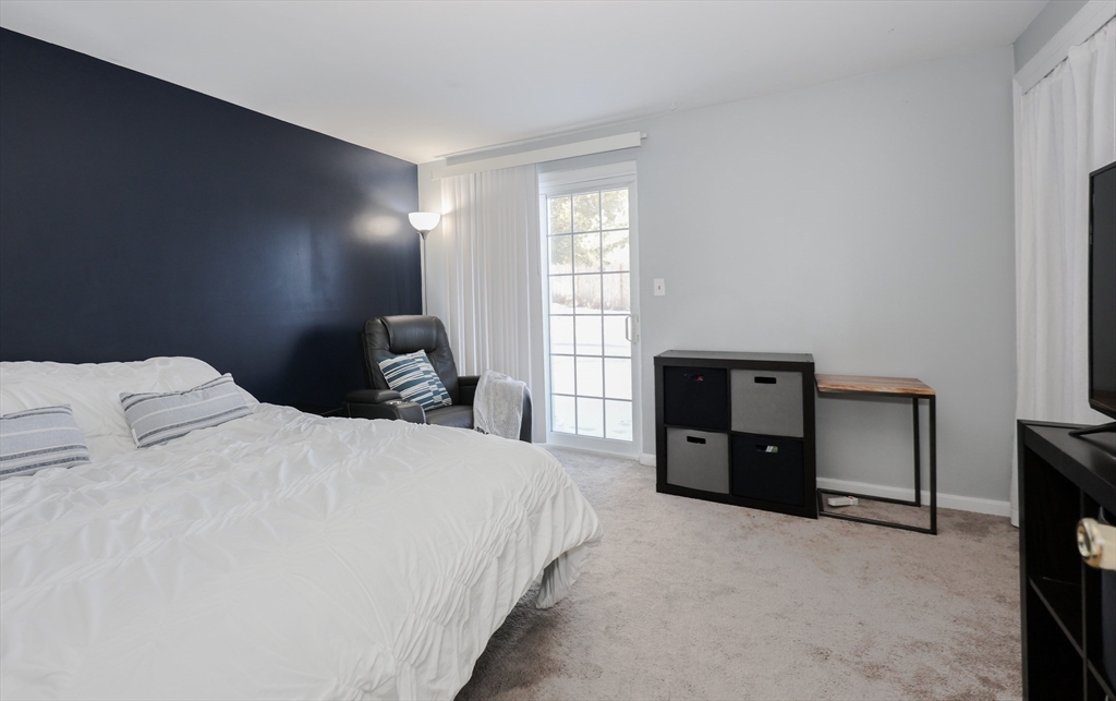 5 East Ridge Road, Unit A Merrimack, NH 03054 - Photo 10 of 19 a bedroom with a bed and a tv