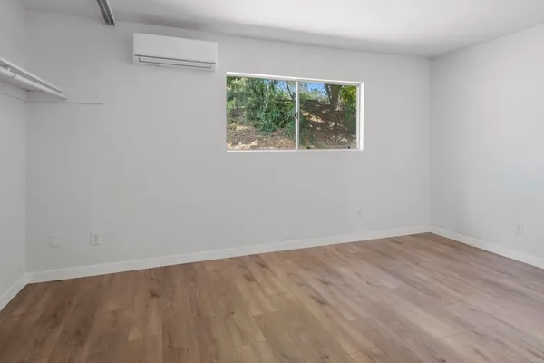 a view of an empty room and window