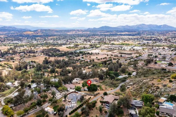 an aerial view of residential house with yard