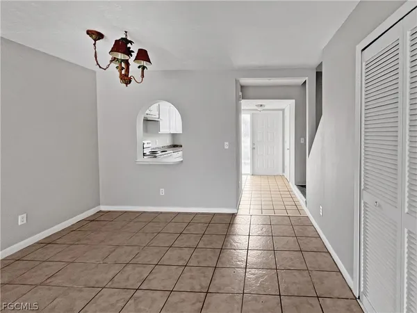 a view of an empty room and a window