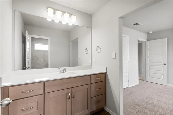 a bathroom with a bathtub and a toilet