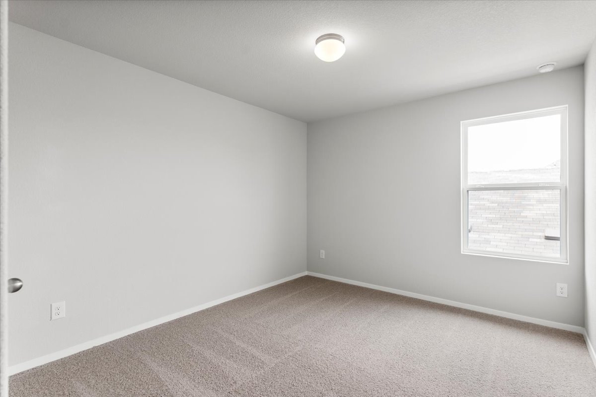 2709 Totley Road Manor, TX 78653 - Photo 32 of 40 an empty room with a window