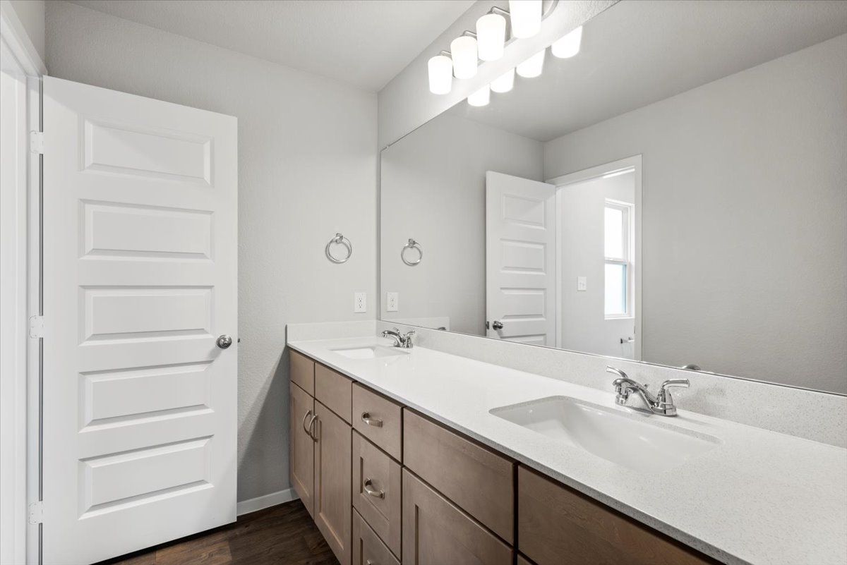 2709 Totley Road Manor, TX 78653 - Photo 33 of 40 a bathroom with a sink a vanity and a mirror