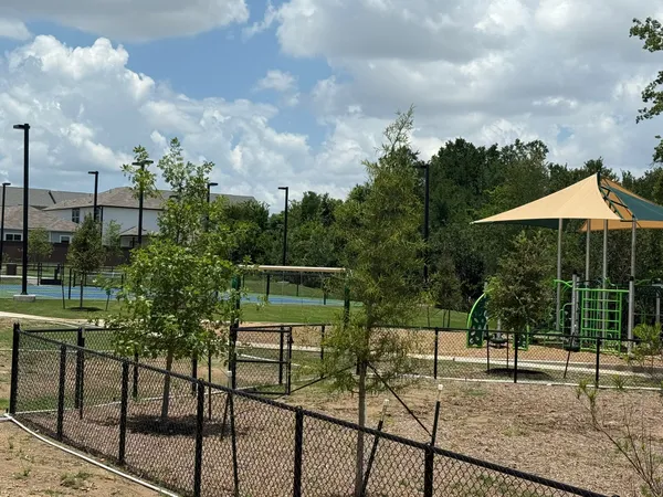 a backyard of a house with lots of green space