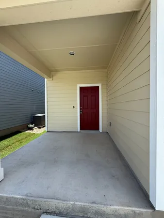 a view of an empty room and garage
