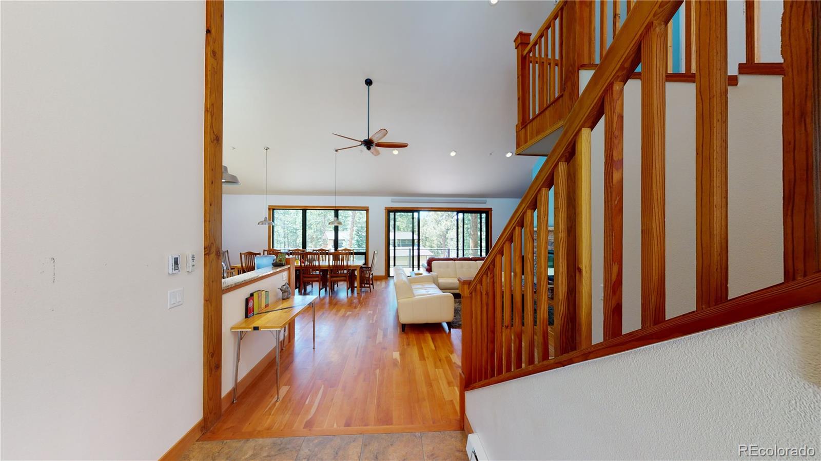 11668 Ranch Elsie Road Golden, CO 80403 - Photo 7 of 40 wooden floor in an empty room with a window