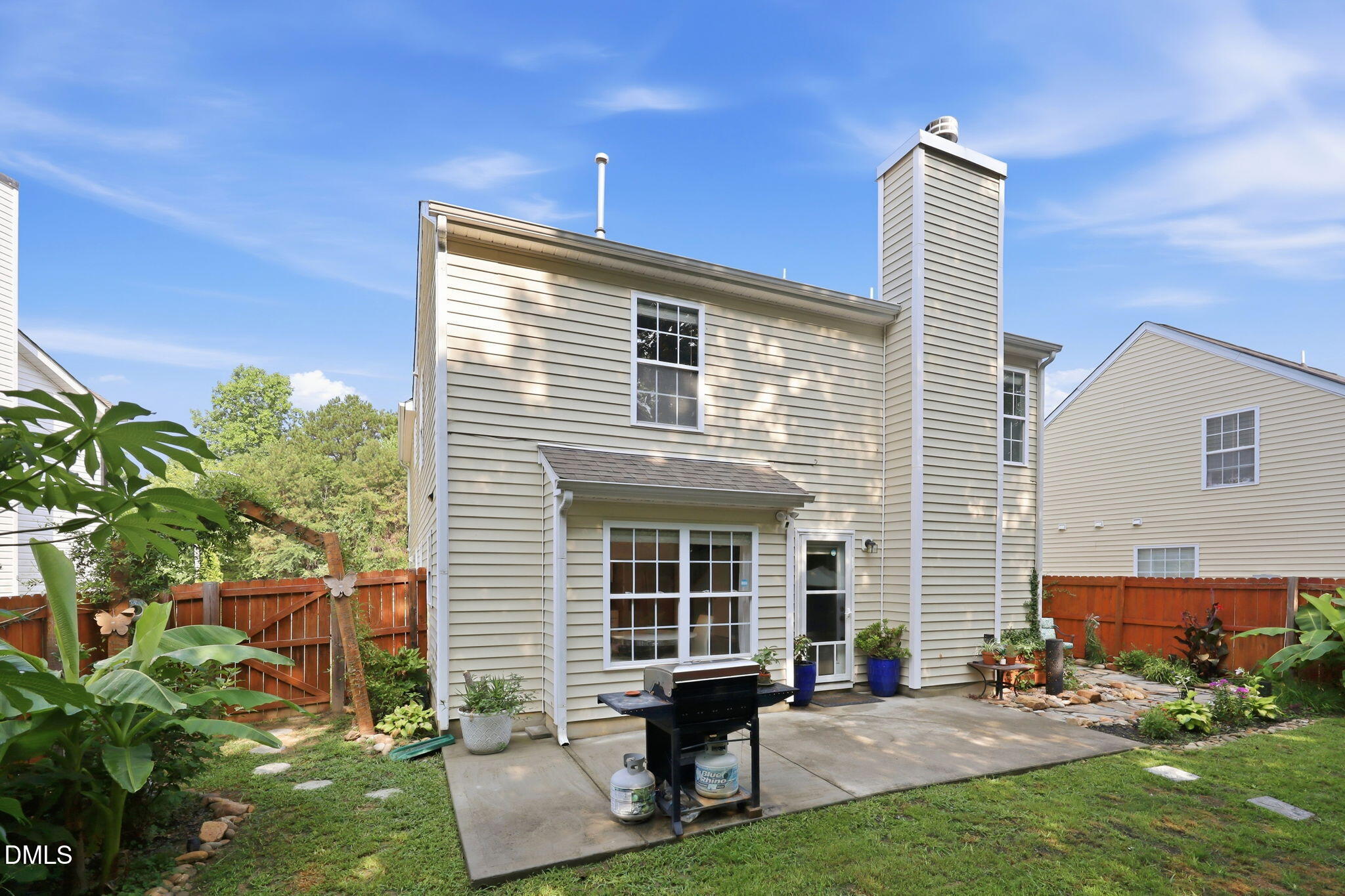 4232 Dalcross Road Raleigh, NC 27610 - Photo 32 of 42 a view of a house with a yard and sitting area
