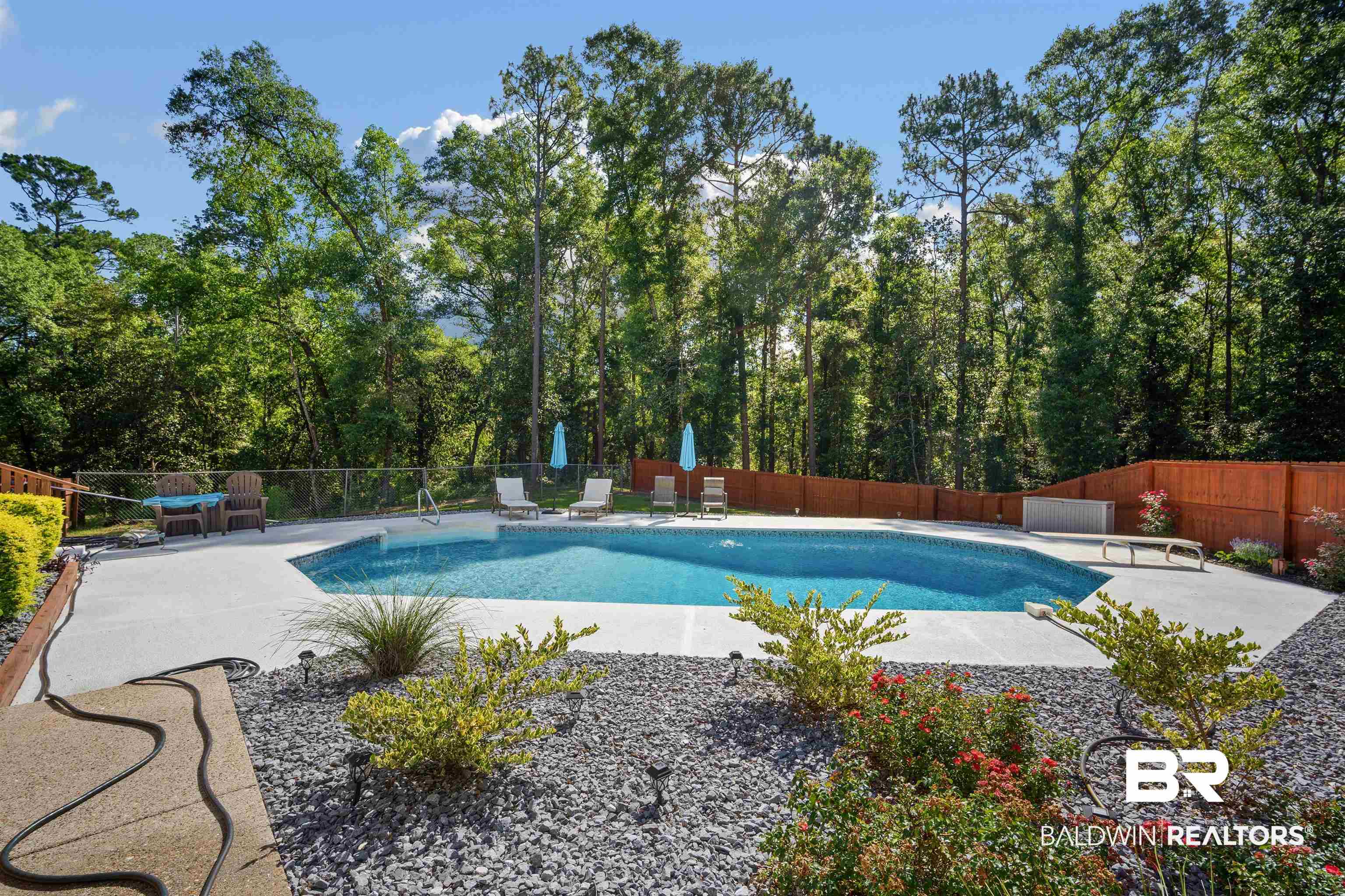7912 Yorkhaven Road Mobile, AL 36695 - Photo 29 of 41 View of swimming pool with a patio area and a fenced backyard
