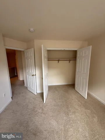 an empty room with a fireplace