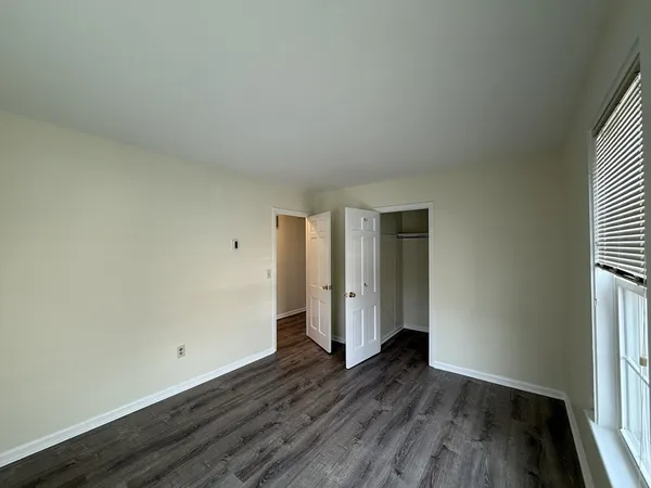 an empty room with wooden floor