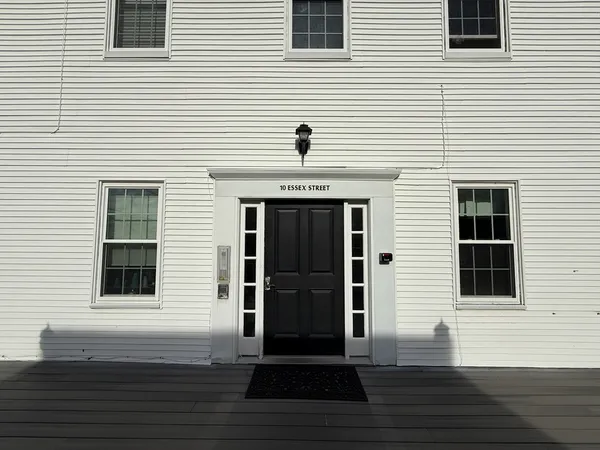 a view of a house with wooden deck