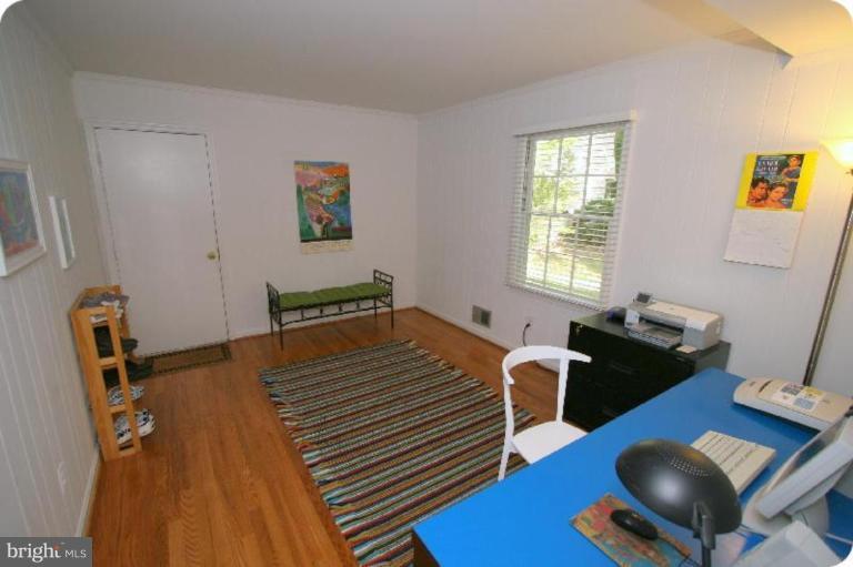 10915 Hunt Club Road Reston, VA 20190 - Photo 13 of 27 a bedroom with a bed and a desk
