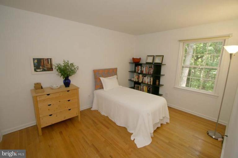 10915 Hunt Club Road Reston, VA 20190 - Photo 17 of 27 a bedroom with a bed and a window