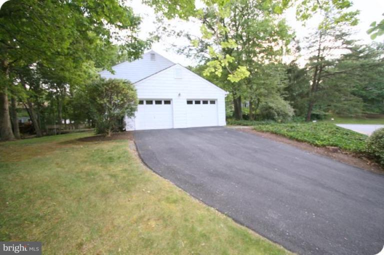 10915 Hunt Club Road Reston, VA 20190 - Photo 25 of 27 a view of a house with a yard and large trees