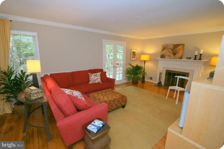 10915 Hunt Club Road Reston, VA 20190 - Photo 9 of 27 a living room with furniture and a fireplace