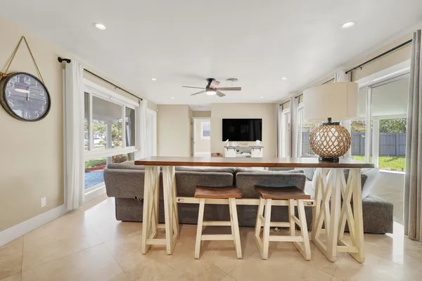 a kitchen with a dining table and chairs