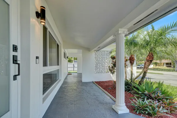 a view of a hallway with windows